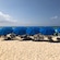 5 beach umbrellas lined up on a shore